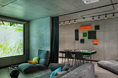 a living room with a couch and a table at Chillout Ślemień nowoczesny dom w górach in Ślemień