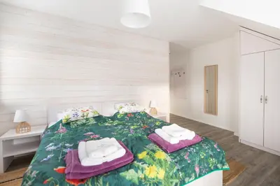 a bedroom with a bed with towels on it at Bliżej Nieba in Skrzydlna