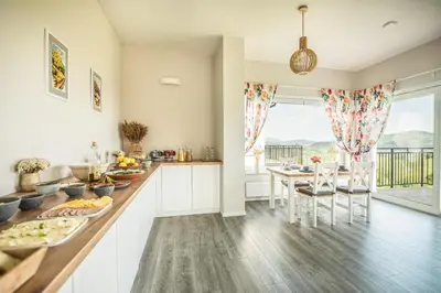 a kitchen with a table and chairs and a dining room at Bliżej Nieba in Skrzydlna