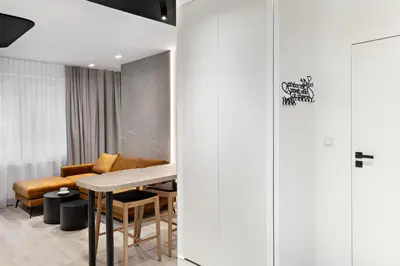 a conference room with a table and a couch at Republiki Korczakowskiej Apartamenty in Kraków
