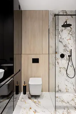 a bathroom with a toilet and a shower at Republiki Korczakowskiej Apartamenty in Kraków