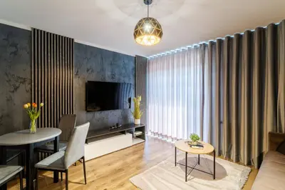 a living room with a couch and a table at Villa Sol in Oświęcim
