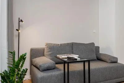 a living room with a couch and a table at Czarnowiejska 21A by Homeprime in Kraków