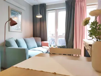 a living room with a couch and a table at Czarnowiejska 21A by Homeprime in Kraków