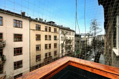 a view of a building through a glass window at Apartament blisko Wawelu in Kraków