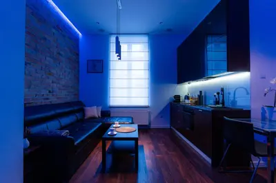 a living room with a couch and a table at Luna Prestige Suite - Old Town Center & Main Station in Kraków