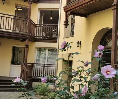 a building with a bunch of flowers in front of it at CHILLOUT APARTMENT SAREGO in Kraków