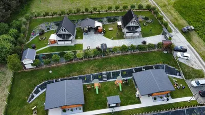 an aerial view of a house with a yard at Domki- Limanowa, domki z balią i sauną in Limanowa