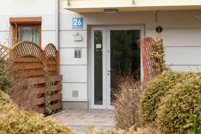 a front door of a house with a sign on it at Bunscha Apartment Dębniki Cracow by Noclegi Renters in Kraków