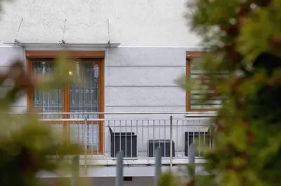a building with two windows and a balcony at Bunscha Apartment Dębniki Cracow by Noclegi Renters in Kraków