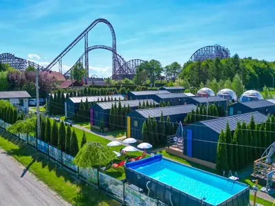 an aerial view of an amusement park with a roller coaster at Holiday Park Zator Resort & Spa in Zator
