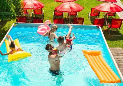 a group of people playing in a swimming pool at Holiday Park Zator Resort & Spa in Zator