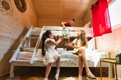 a playground with a slide and a climbing frame at Holiday Park Zator Resort & Spa in Zator