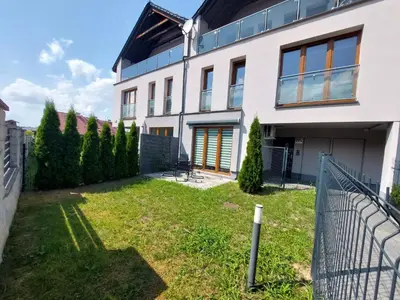 a house with a yard in front of it at Apartament Reformacka in Wieliczka