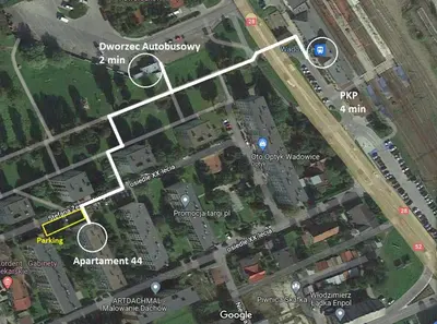 a bathroom with a shower and a toilet and a sink at Apartament 44 in Wadowice