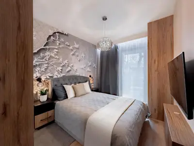 a bedroom with a bed and a large window at Apartament z dużym tarasem w centrum Krakowa in Kraków