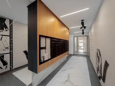 a hallway with a wall with paintings on it at Apartament z dużym tarasem w centrum Krakowa in Kraków