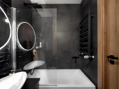 a bathroom with a tub and a sink and a mirror at Apartament z dużym tarasem w centrum Krakowa in Kraków