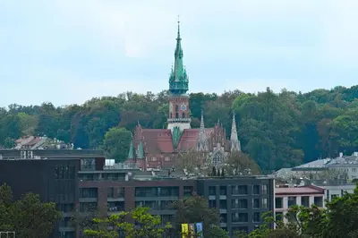 a building with a clock tower on top of it at Urban Nest Apartments Starowiślna 95 in Kraków