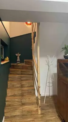 a staircase in a room with a cross on the wall at Beskid Family&Chill in Tenczyn
