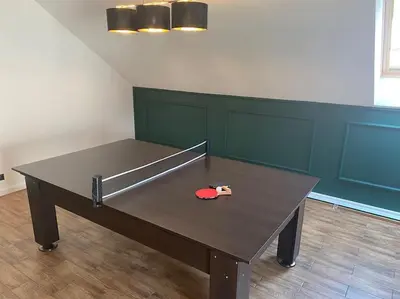 a ping pong table with a ping paddle on it at Beskid Family&Chill in Tenczyn