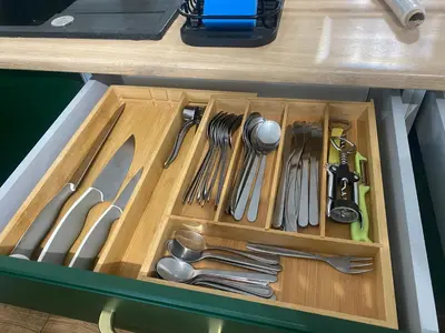 a drawer filled with utensils on a table at Beskid Family&Chill in Tenczyn