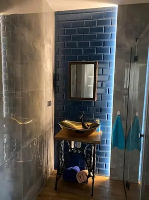 a bathroom with a sink and a mirror at Beskid Family&Chill in Tenczyn