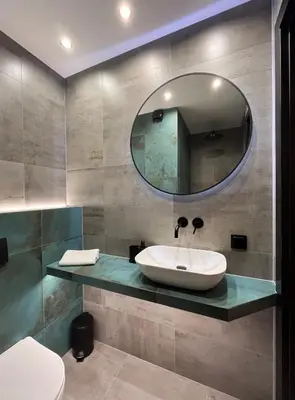 a bathroom with a sink and a mirror at PM. Apartments Krakow in Kraków