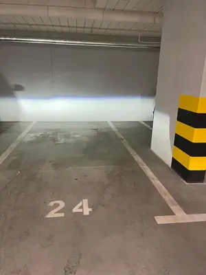an empty parking garage with the number twenty four at PM. Apartments Krakow in Kraków