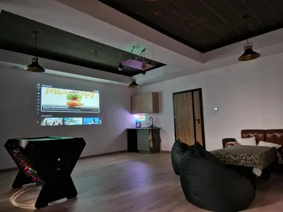 a living room with a tv and a couch at Bulwary Mszańskie - Pokoje in Mszana Dolna