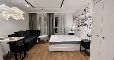 a small bedroom with a bed and a couch at Way2Stay Centrum in Kraków