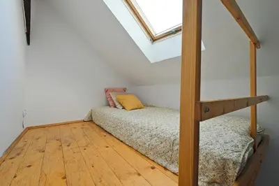a bedroom with a bunk bed and a window at Urban Nest Apartments Augustiańska 4 in Kraków