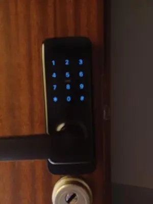 a close up of a remote control on a door at REAL Hostel in Kraków