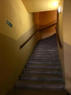 a flight of stairs in a building at REAL Hostel in Kraków