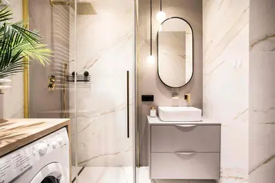 a bathroom with a sink and a mirror at Apartment Premium with Parking, Air Condition and balcony in Kraków
