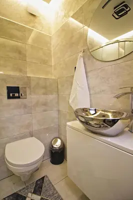 a bathroom with a toilet and a sink at Motel Na Zbójeckiej in Skawa