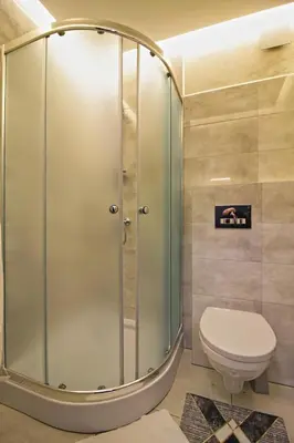 a shower stall in a bathroom with a toilet at Motel Na Zbójeckiej in Skawa