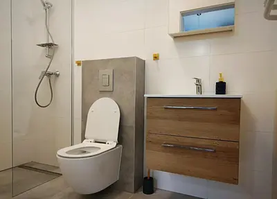 a bathroom with a toilet and a sink and a shower at Hugo Star Apartments in Kraków