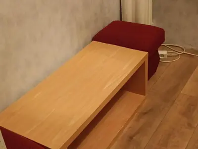 a wooden desk with a red chair in a room at Time for Cracow in Kraków