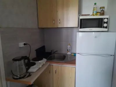 a kitchen with a white refrigerator and a microwave at Time for Cracow in Kraków