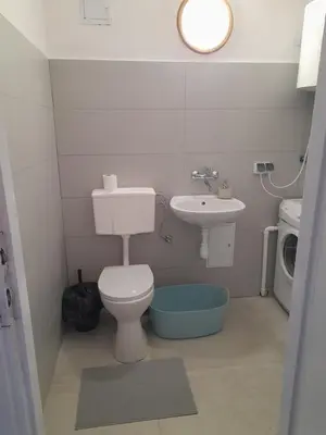a small bathroom with a toilet and a sink at Time for Cracow in Kraków