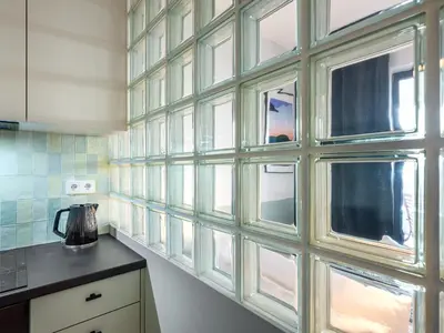 a bathroom with a sink and a shower with a mirror at Wislane Tarasy II by Tyzenhauz in Kraków