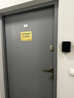 a sign on a door with a sign on it at Apartament z Jacuzzi Kraków GLAMOUR Starowiślna in Kraków