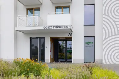 an office building with the entrance to the ak building at Saska Blu Studios Premium by Noclegi Renters in Kraków