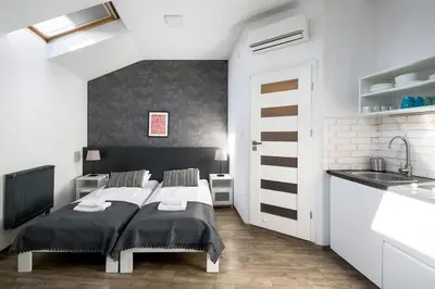 a bedroom with a bed and a sink in it at Modern apartment in the very central location 20 in Kraków