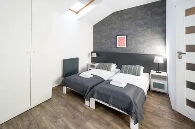 a bedroom with two beds in a room at Modern apartment in the very central location 20 in Kraków