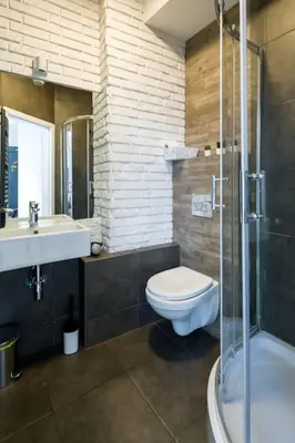 a bathroom with a toilet and a sink and a shower at Modern apartment in the very central location 20 in Kraków