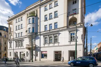 a building with a car parked in front of it at Modern apartment in the very central location 20 in Kraków