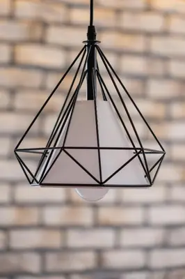 aendant light hanging in front of a brick wall at Business Apartment for Home Office Kołaczy Kraków by Noclegi Renters in Kraków