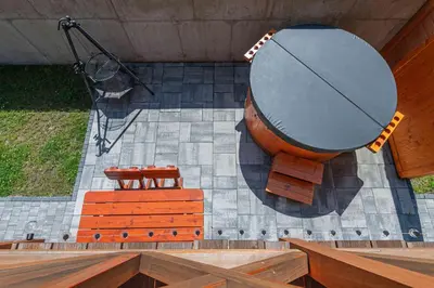 a stage with a large circle and some chairs at Domki Gorczański Zakątek - Jacuzzi in Nowy Targ